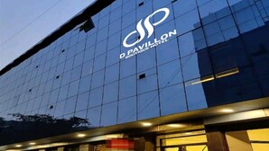 A modern building with a glass facade and a logo for 'D. Pavillon Boutique Hotel' on the upper part. - D Pavillon Boutique Hotel Delhi Airport (New Delhi)