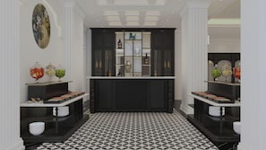 A hallway with a black and white patterned floor, a central dark wooden cabinet with glass shelves, and a decorative painting on the wall. - Elegant Hotel (Da Lat)