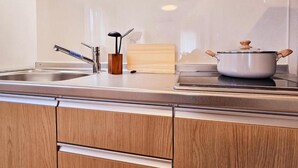 Departamento, varias camas, para no fumadores | Cocina privada | Refrigerador con congelador, microondas y parrilla de estufa 