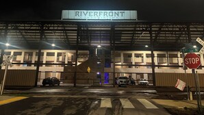 A gated entrance to a Riverfront Condominium complex with a stop sign and railroad crossing signs. - Riverside Rhythm! Waterfront condo near Broadway, Nissan Stadium, Sounds, etc! (Nashville)
