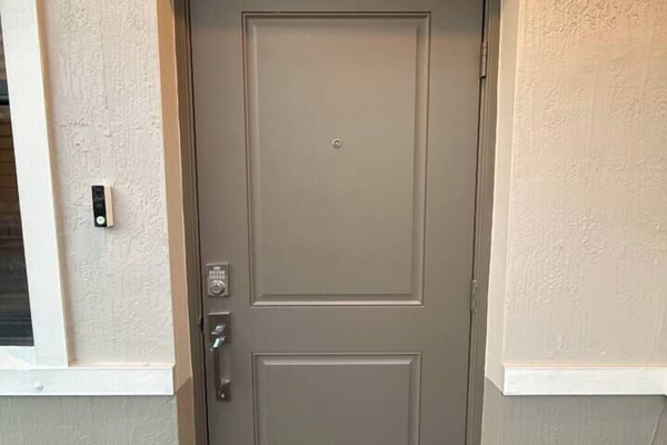 Modern private entry with keypad access and a clean, welcoming look