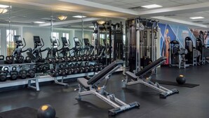 A gym with various exercise equipment, including treadmills, dumbbells, and weight machines. - 2BR Villa @ Newport Coast Villas ~ Full Resort Access (Newport Beach)