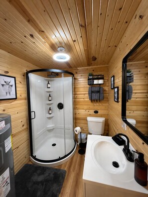 Shower, hair dryer, towels, soap