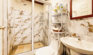 Shower, towels, soap, toilet paper