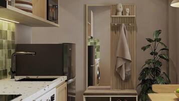 Suíte júnior, sacada | Cozinha privada | Geladeira, cooktop, talheres/pratos/utensílios de cozinha