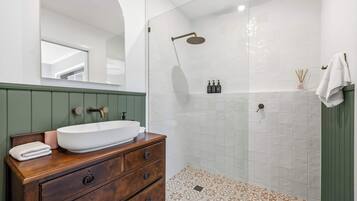 Shower, hair dryer, towels, shampoo
