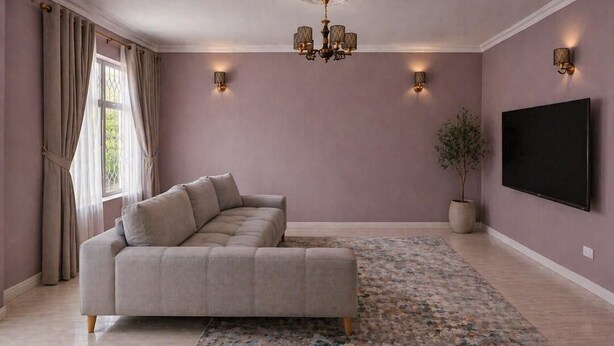 A living room with a sectional sofa, a flat-screen TV, a chandelier, wall sconces, and a potted plant. - House of FAVOR (Lilongwe)