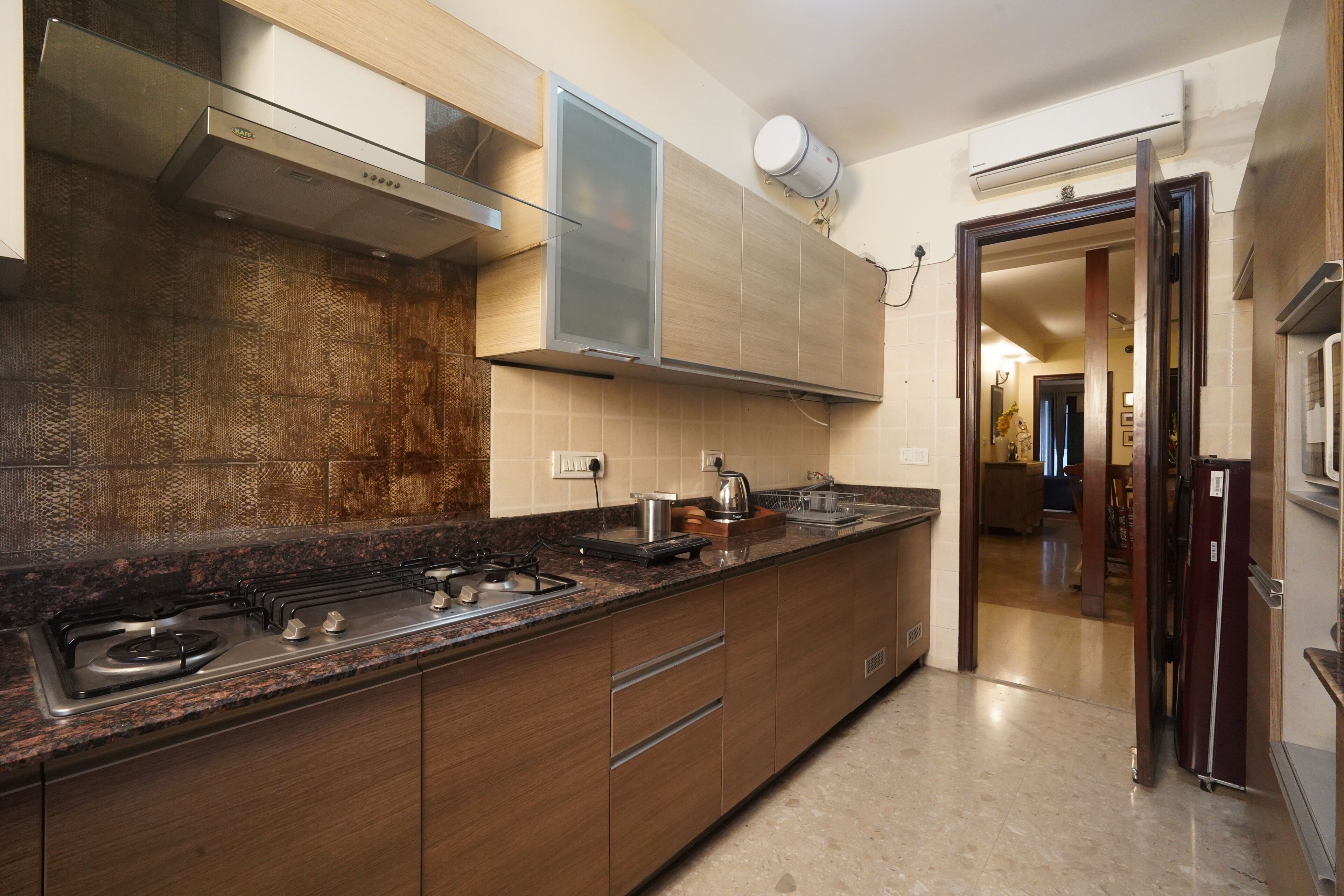 Apartamento | Cozinha privada | Geladeira grande, cafeteira/chaleira