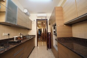 Apartment | Private kitchen | Full-size fridge, coffee/tea maker - Nitya Private Residences (New Delhi)