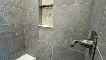 Shower, hair dryer, towels, shampoo