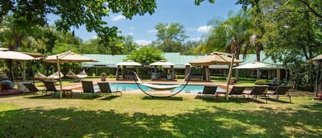 Outdoor pool, pool umbrellas, sun loungers