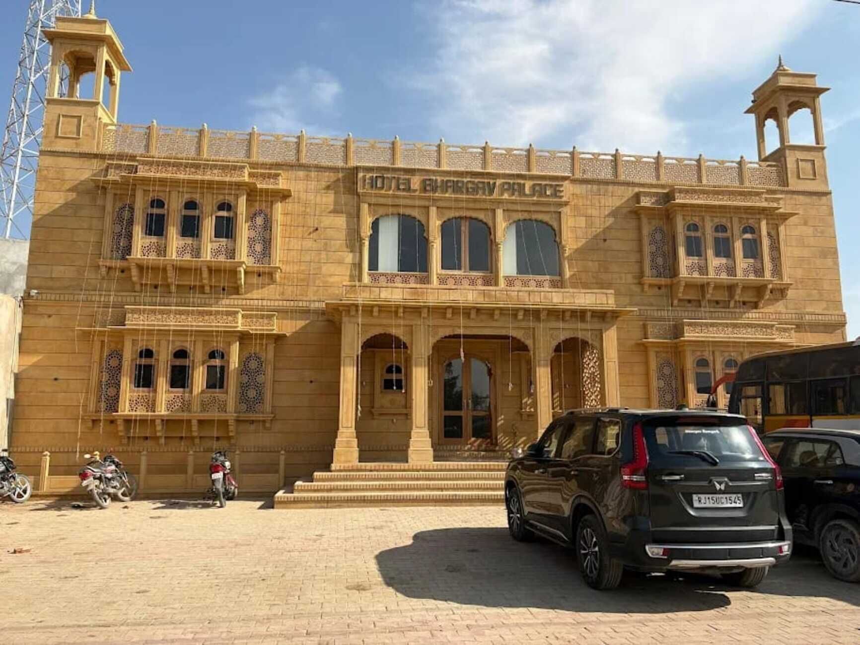 A large building with a sign reading 'HOTEL MARGAV PALACE.'