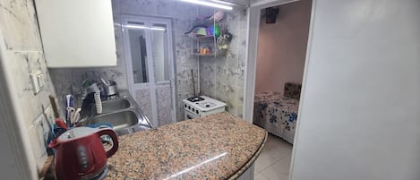 Fridge, stovetop, coffee/tea maker, cookware/dishes/utensils