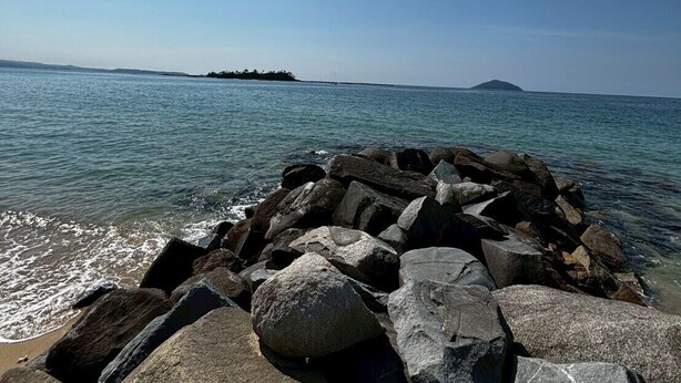 A rocky shoreline with large boulders and calm water. - 60 seconds to the ocean. Just one train ride from Fukuoka Airport. Old-fashioned Japan—something you can't experience at a hotel. Entire traditional Japanese house for rent. (糸島市)