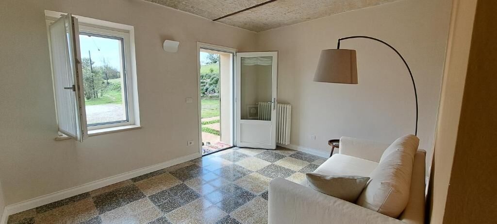 Suite, patio, vista giardino | Area soggiorno