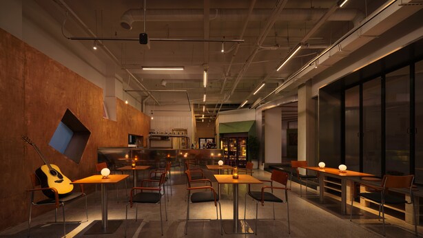Un interior moderno con mesas y sillas, una guitarra y una zona de bar.