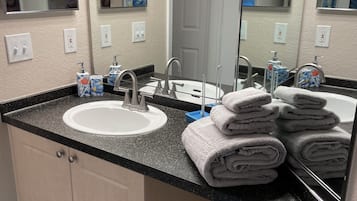 Hair dryer, towels, soap, toilet paper