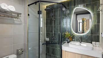 Shower, hair dryer, slippers, towels