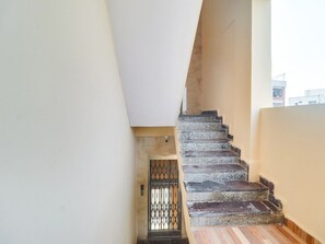 A staircase leading to a door with a metal gate. - Super Collection O Rbs Kothapet-nagole Road (Hyderabad)