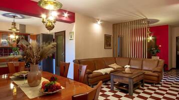 Apartment (Three Bedroom Apartment with Balcony) | Living room | 32-inch flat-screen TV with digital channels