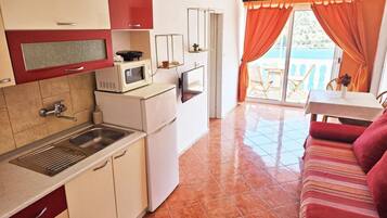 Apartment (Two Bedroom Apartment with Sea View a) | Private kitchen | Fridge