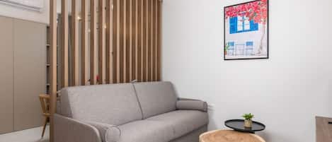 Apartment (One Bedroom Apartment with Balcony) | Living room | 32-inch flat-screen TV with satellite channels