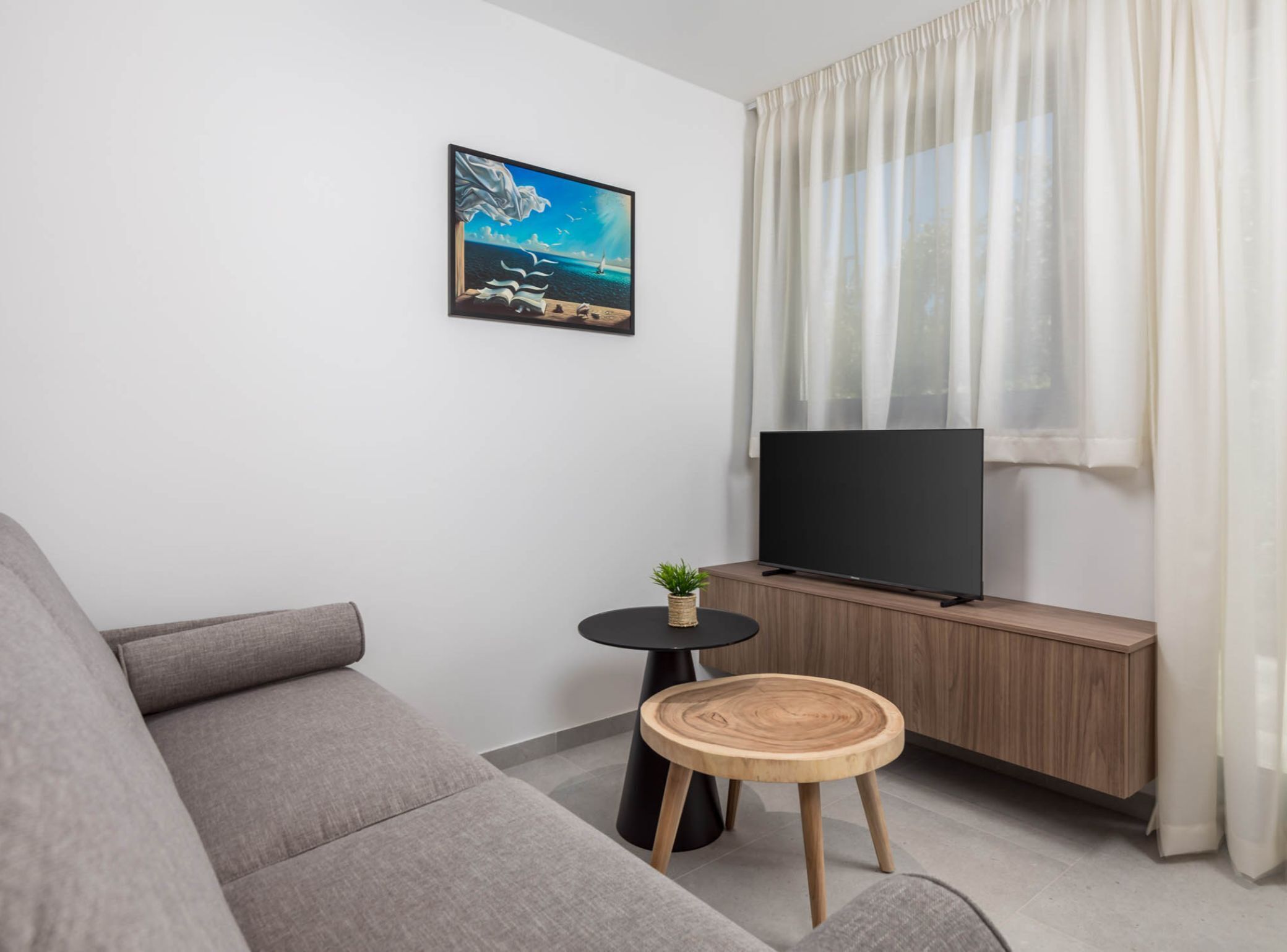 Apartment (Classic One Bedroom Apartment with Ba) | Living room | 32-inch flat-screen TV with satellite channels
