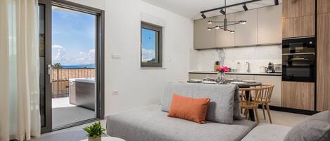 Apartment (Classic Apartment with Balcony) | Living room | 32-inch flat-screen TV with satellite channels