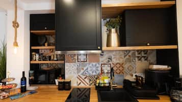 Studio (Studio Apartment) | Private kitchen | Fridge