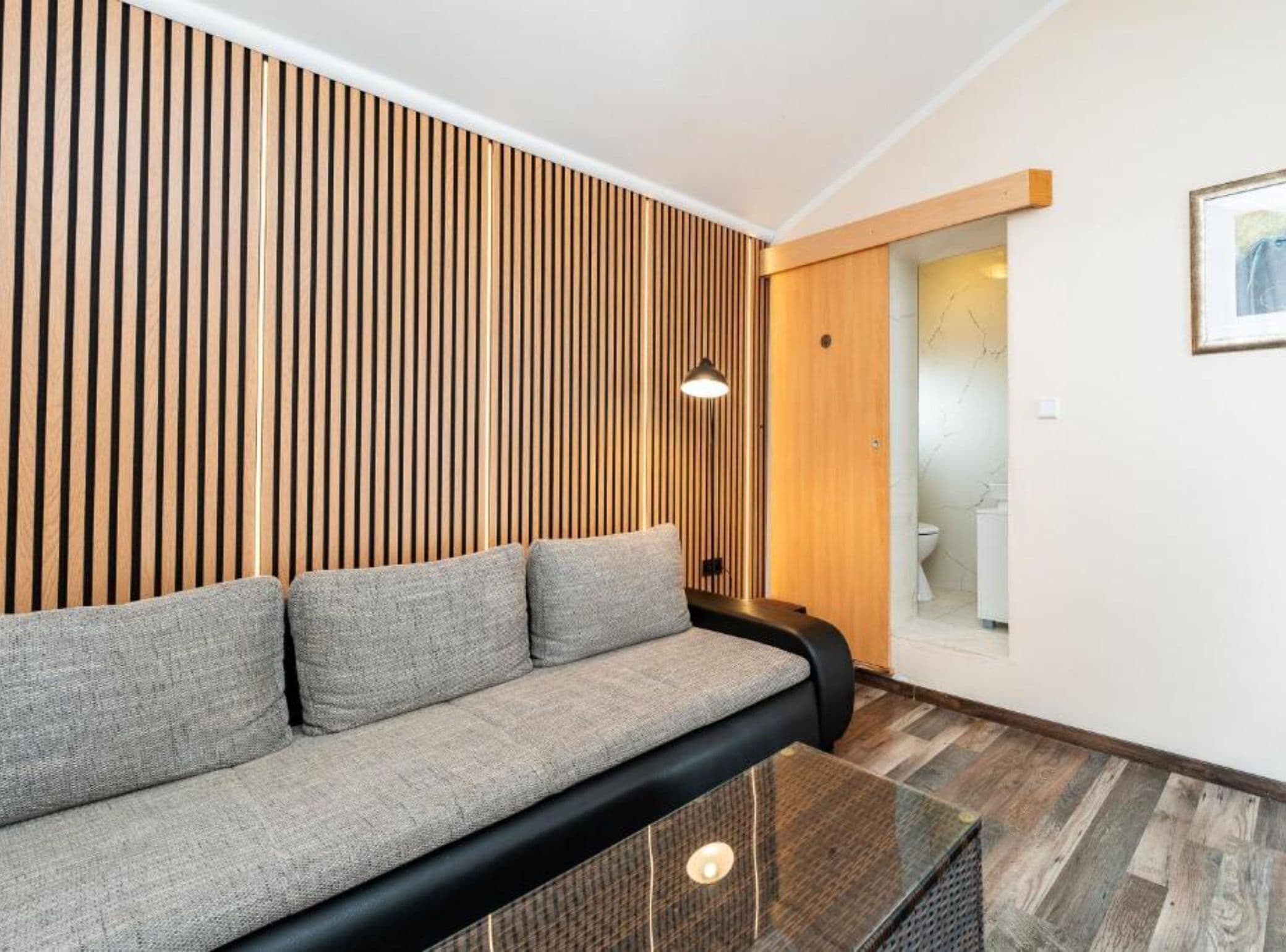 Apartment (One Bedroom Apartment with Balcony) | Living room | 32-inch flat-screen TV with satellite channels