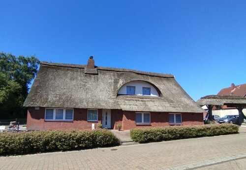 Relax under thatch with pool, beach chairs and loungers