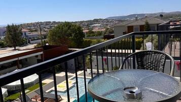 Standard Triple Room, Balcony, Pool View | Outdoor dining