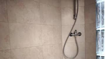 Shower, towels, soap, toilet paper