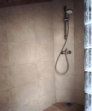 Shower, towels, soap, toilet paper
