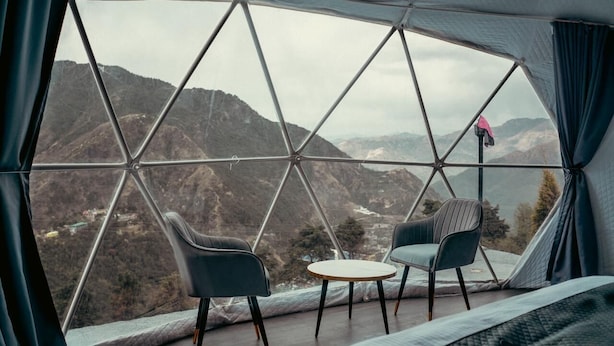 A tented room with a view of mountains, two chairs, and a small table. - Manzil Escapes (Dhanaulti)