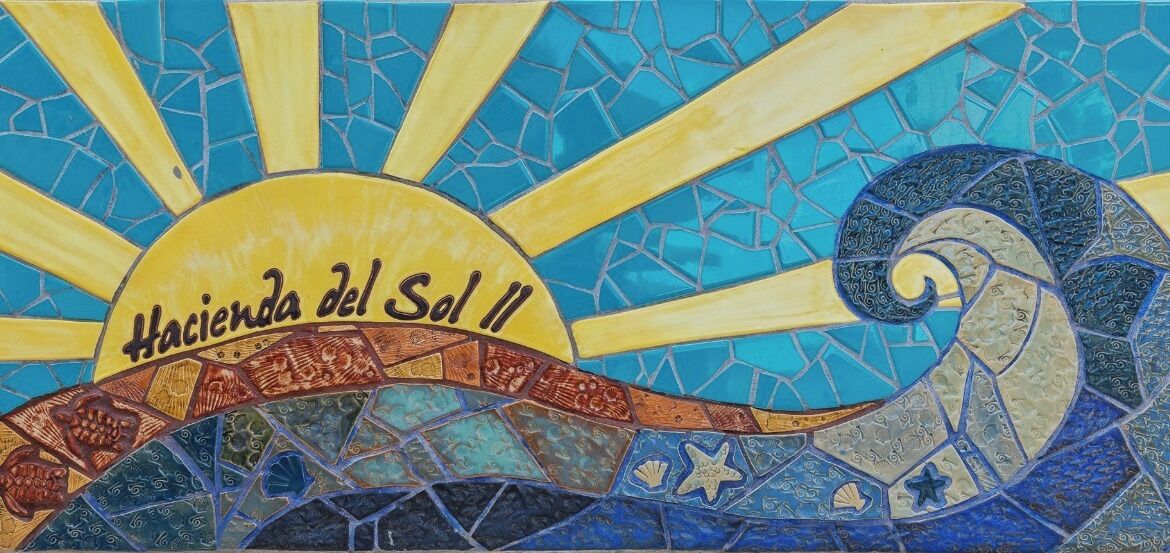 A mosaic with a sun and a wave pattern, labeled 'Hacienda del Sol II'.