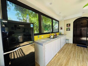 Private kitchen - Cozy Haven Nest – Sunlit Glass & Green Views (Van Phu)