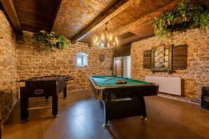 A room with a pool table, foosball table, and a billiards table. - Villa Zvonimir Zadarvillas (Promina)