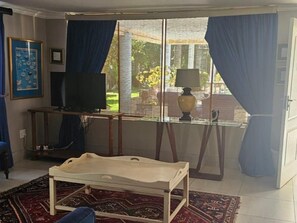 Classic Double Room | Living area | 32-inch Smart TV with cable channels