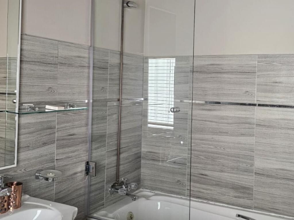 Combined shower/tub, hair dryer, towels, soap