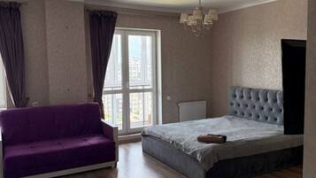 Comfort Studio, Balcony, City View | Living area | Flat-screen TV