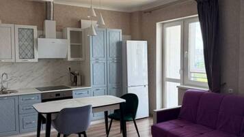 Comfort Studio, Balcony, City View | Living area | Flat-screen TV