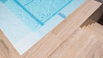 Indoor pool, seasonal outdoor pool, pool umbrellas, pool loungers