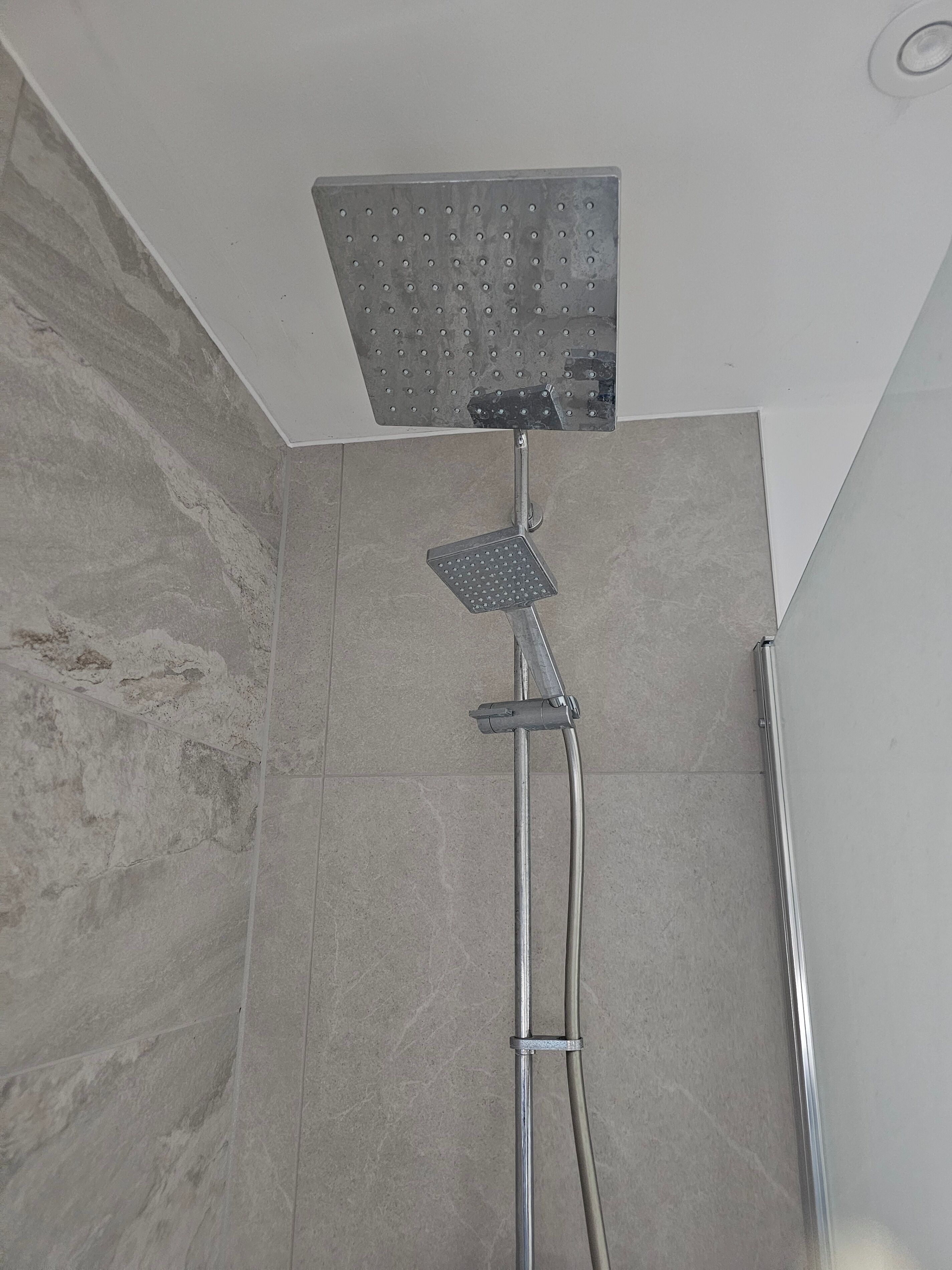 Combined shower/bathtub, deep-soaking bathtub, hair dryer, towels