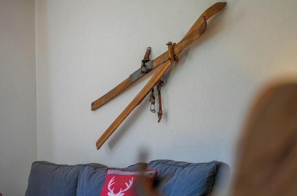 A wall-mounted wooden structure resembling a crossbow.