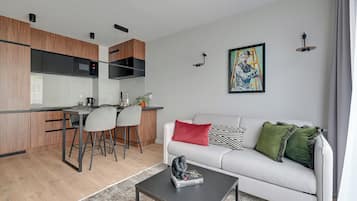 Comfort Apartment, Balcony | Living area | 40-inch flat-screen TV with cable channels