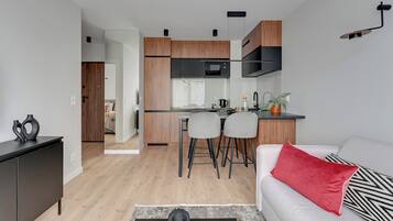 Comfort Apartment, Balcony | Living area | 40-inch flat-screen TV with cable channels