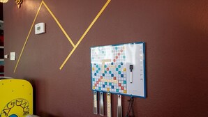 A room with a wall-mounted Scrabble game board and a thermostat. - Sauna, Free Dollywood & More, Views! - (Gatlinburg)