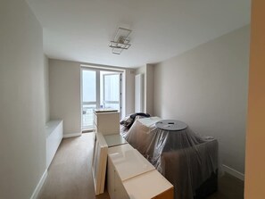 A room with a large window, a bed, a desk, and a chair. - 10 Mins Walk to Bond Street Marylebone Retreat (London)