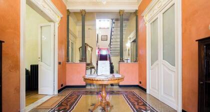 The Riviera apartment, located on the ground floor of Villa Aranci in Via Fabio Filzi 2B, Genoa, offers an elegant and comfortable stay in an exclusive setting.With a private entrance, double bedroom, living area, private bathroom, and direct access to t